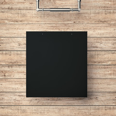 black blank frame hanging on timber wall