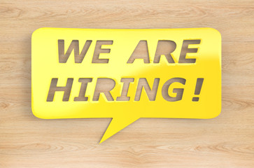 we are hiring with speech bubble on wooden  background
