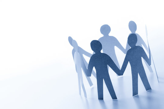 Paper people standing together hand in hand. Team, glabal business connection concept