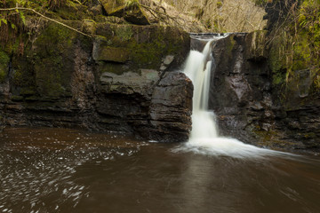 Waterfall on Hareshaw Burn near Bellingham in the county of Northumberland, England, UK.