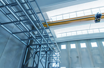 Sunny spacious hangar area with concrete floor and windows in fl