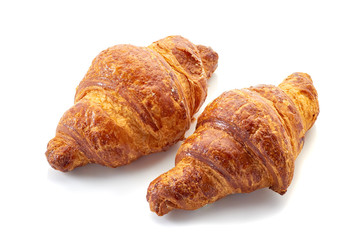 Two fresh croissants isolated on white background