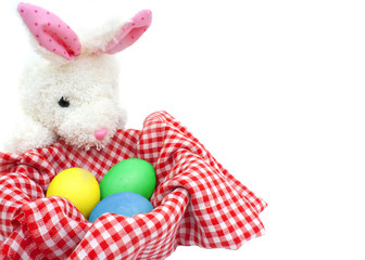 White rabbit with eggs on white background