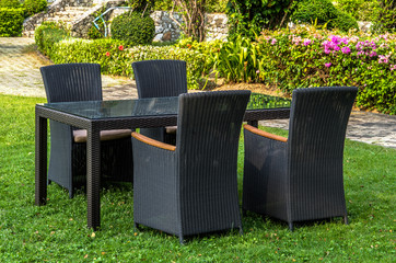 Rattan furniture, table and chairs, cushion  outdoors