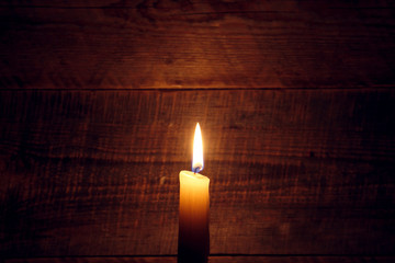 Background with candles light on wood