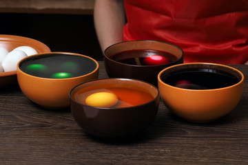 Preparing for the holiday Easter. The process of painting eggs with food coloring 