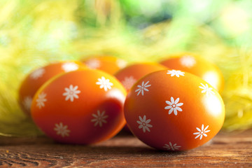 Orange Easter eggs on wooden table