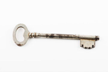 Old key on white background.