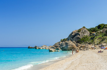 Obraz premium Wild beach of Megali Petra. A beautiful beach with large rocks in the water. Megali Petra Beach, Lefkada Island, Levkas, Lefkas, Ionian sea,