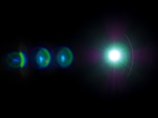 optical lens flare in the dark from the light source