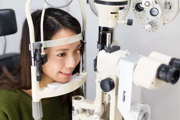 Woman undergoing optical examination