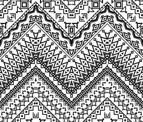 Seamless hand drawn chevron pattern with ethnic and tribal ornament. Vector black and white fashion illustration