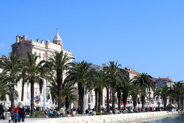 Fototapeta na wymiar Sunny day on Riva (sea promenade) in Split, Croatia. Split is popular touristic coastal destination in Croatia. 