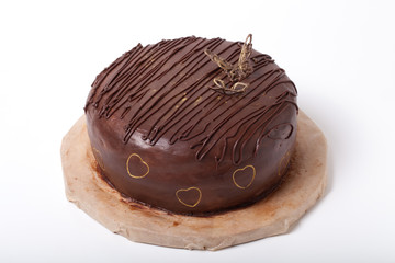 Chocolate homemade cake with gold decor