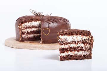 Chocolate homemade cake with gold decor. Shallow depth of field.