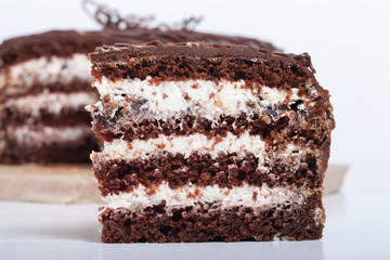 Chocolate homemade cake with gold decor. Shallow depth of field.