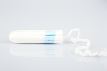 clean cotton tampon on bright background