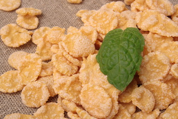 corn flakes on sack background closeup