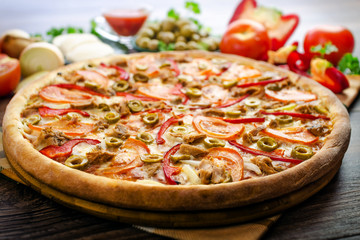 pizza with tuna on the table