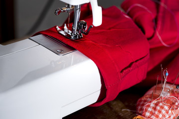 view of a tailored suit from a tailor in his studio. dress with basting child