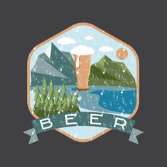 Obraz premium grunge label of beer glass with mountains