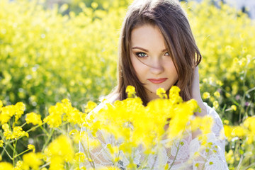 Adorable woman in field with flowers