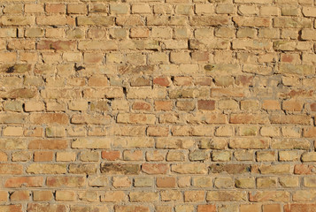 old painted brick wall close-up.