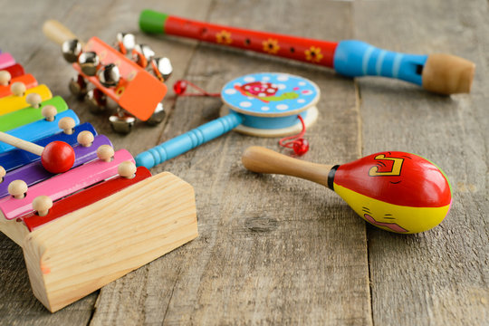 Musical instruments on wooden background