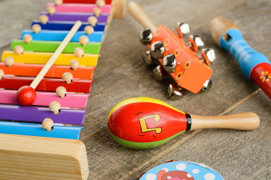 Musical instruments on wooden background