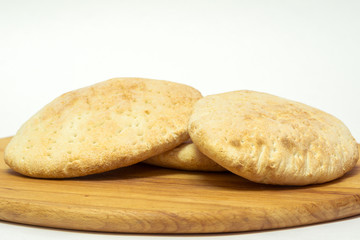 Italian bread, ciabatta. on a wooden board. isolated object