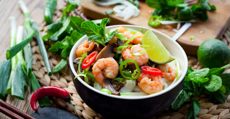 prawn noodles -  spicy asian meal with mushrooms, chili, mint and lime - bún gạo với tôm
