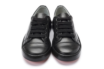 Boys black school shoes on a white background