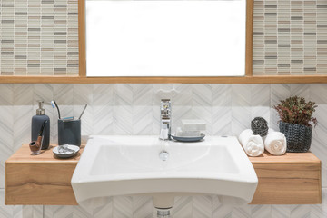 Fototapeta na wymiar Washbasin with towel and decoration in bathroom