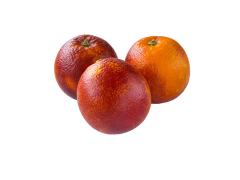 Three colorful red sicilian oranges isolated on white