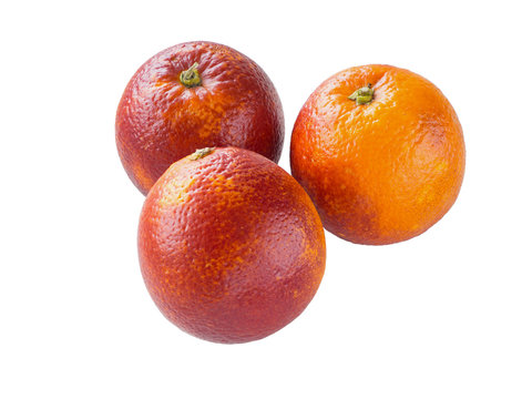 Three colorful red sicilian oranges isolated on white