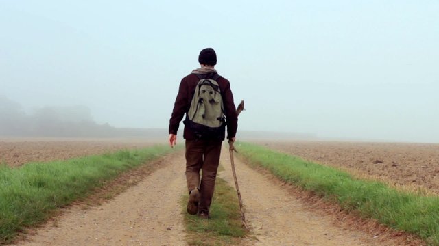 Traveler walks away into the mist. Part of my Journey Collection