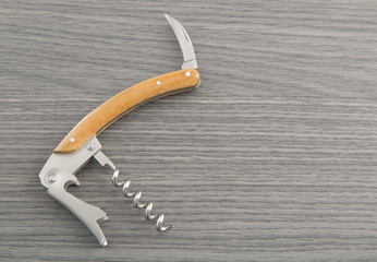 wine opener on wooden table