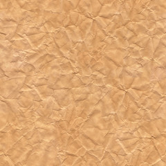 Crumpled brown paper. Texture sheet background. Seamless tileabl
