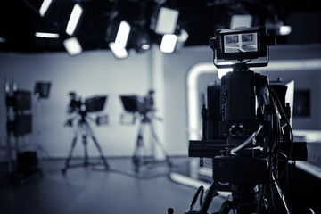 TV Studio live broadcasting.Recording show.TV NEWS program studio with video camera lens and...