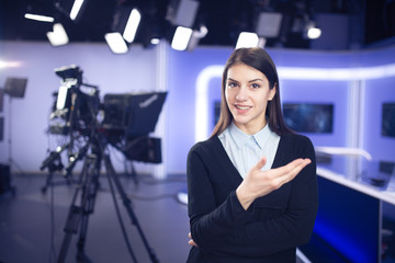 Woman journalist working as reporter,correspondent or broadcast news analysts in TV studio.Public...