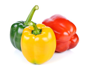 colored peppers over white background
