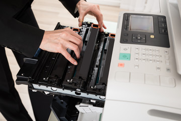 Businesswoman Hand Fixing Copy Machine
