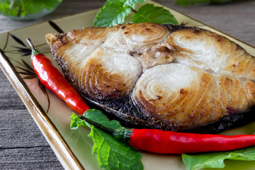 King mackerel steak on wood background,fried fish