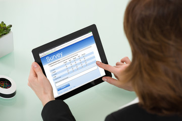 Businesswoman Filling Online Survey Form