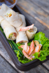 Fresh spring rolls, vegetables wrapped in dough, topped with cra