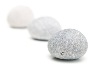 Fototapeta na wymiar round stones on white