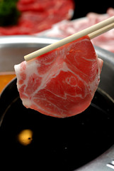 Slice Beef hold with chopstick