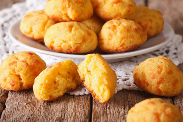 Tasty cheese buns gougere close-up of a plate on the table. Horizontal
