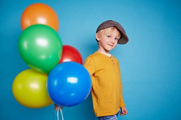 Fototapeta na wymiar Boy with balloons