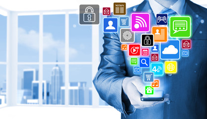 Business man using smart phone with social media icon set